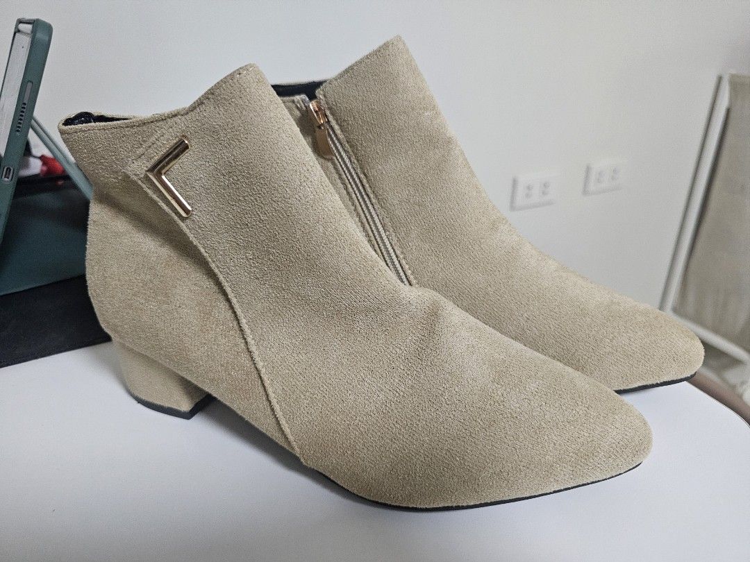 Beige Suede Ankle Boots Size 40 (Category: Boots) located in Santo Tomas. Submitted by buybugs (Listing ID 1469496601, Image 1). Description: - Style: Beige suede ankle boots with pointed toe and low block heel - Size: EU 40 (marked on outsole) - Closure: Convenient side zipper - Details: Elegant metal accent near the top collar - Condition: Brand new, never worn out, completely clean soles.