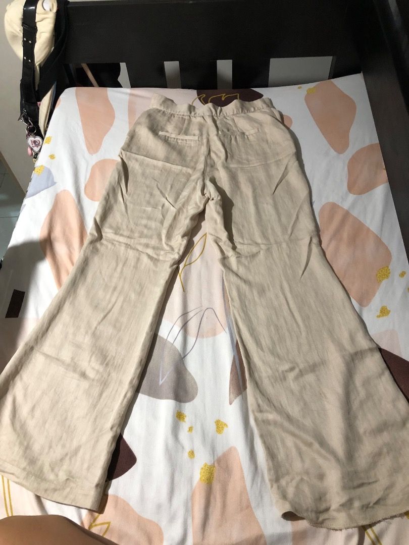 Beige Wide Leg Trousers (Category: Jeans) located in Manila. Submitted by luckytiger_0a94ff (Listing ID 1469484156, Image 1). Description: - Color: Versatile beige - Fit: High-waist with a relaxed, wide-leg cut - Details: Features functional back pockets - Fabric: Lightweight and textured for all-day comfort - Styling: Perfect for pairing with basic tees or elegant blouses.