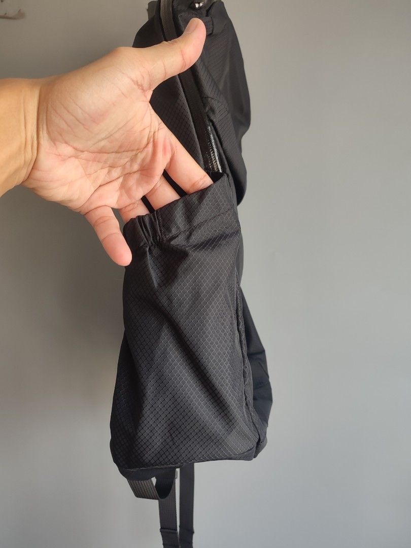 Bellroy Black Backpack (Category: Backpacks) located in Lipa City. Submitted by gudoys_outdoor16 (Listing ID 1469441958, Image 2). Description: - Brand: Bellroy - Material: Durable black ripstop fabric - Interior: Wide-opening main compartment with bright yellow lining - Pockets: Exterior zippered front pocket and stretchy side bottle pockets - Comfort: Padded mesh shoulder straps with adjustable sternum strap - Design: Lightweight and packable—i