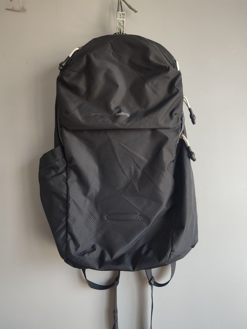 Bellroy Black Backpack (Category: Backpacks) located in Lipa City. Submitted by gudoys_outdoor16 (Listing ID 1469441958, Image 1). Description: - Brand: Bellroy - Material: Durable black ripstop fabric - Interior: Wide-opening main compartment with bright yellow lining - Pockets: Exterior zippered front pocket and stretchy side bottle pockets - Comfort: Padded mesh shoulder straps with adjustable sternum strap - Design: Lightweight and packable—i