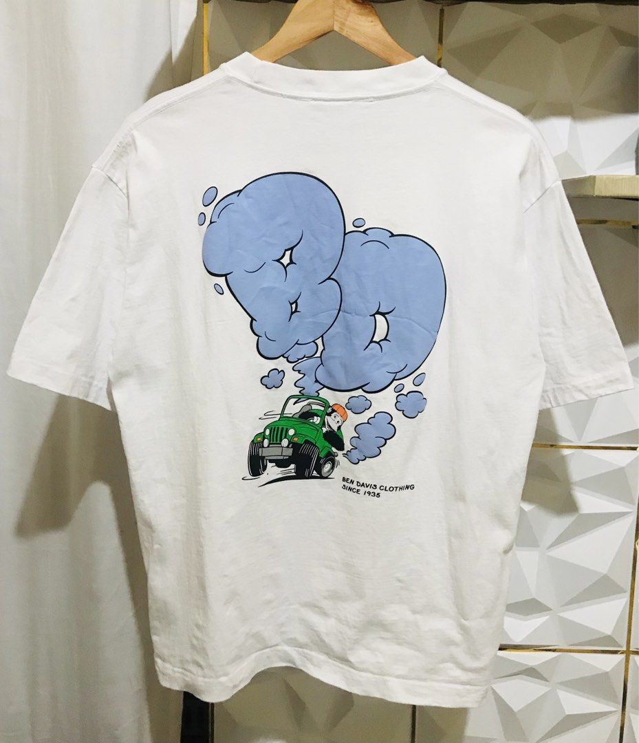 Ben Davis Oversized T-Shirt Medium Jeep Graphic White (Category: Tshirts & Polo Shirts ) located in Rizal. Submitted by drthrifttwo (Listing ID 1469572013, Image 1). Description: - Brand: Ben Davis - Size: Medium (Oversized fit) - Color: White - Design: Cool back graphic with a green jeep and blue cloud lettering, plus classic monkey logo tag on the collar - Material: 100% cotton (comfortable and breathable) - Measurements: ~21" pit to pit, ~26.5