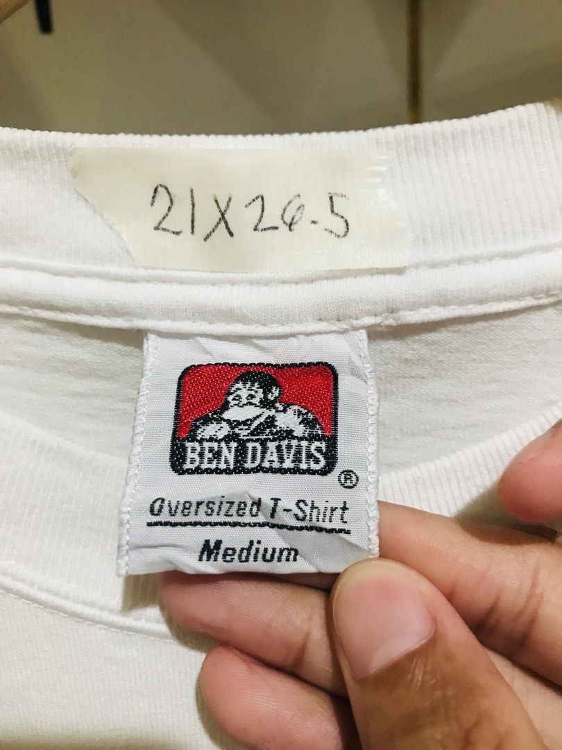 Ben Davis Oversized White Graphic T-Shirt Medium (Category: Tshirts & Polo Shirts ) located in Rizal. Submitted by drthriftone (Listing ID 1469572280, Image 3). Description: - Brand: Ben Davis - Color: White - Fit: Oversized Medium (Pit-to-pit: 21", Length: 26.5") - Design: Cool green jeep graphic printed on chest and back - Material: 100% breathable and comfortable cotton - Condition: Strong and sturdy construction with original tags intact.