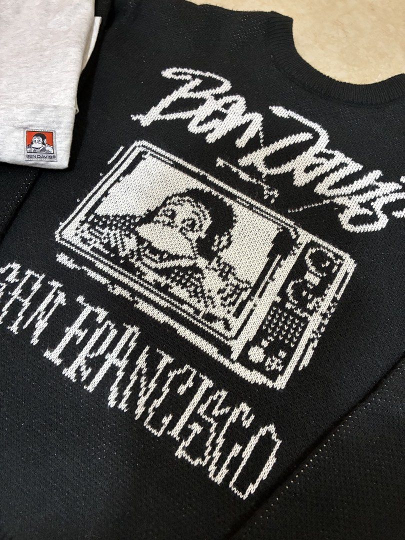 Ben Davis San Francisco Graphic Knit Sweater (Category: Coats, Jackets and Outerwear) located in San Pedro. Submitted by kendrickkiff2023 (Listing ID 1469396148, Image 3). Description: - Brand: Ben Davis - Color: Black - Design: Large white chest graphic with 'Ben Davis', 'San Francisco', and a TV monkey character - Details: Ribbed collar, cuffs, and hem - Style: Clean streetwear piece - Note: Pit to pit and length measurements available upon req