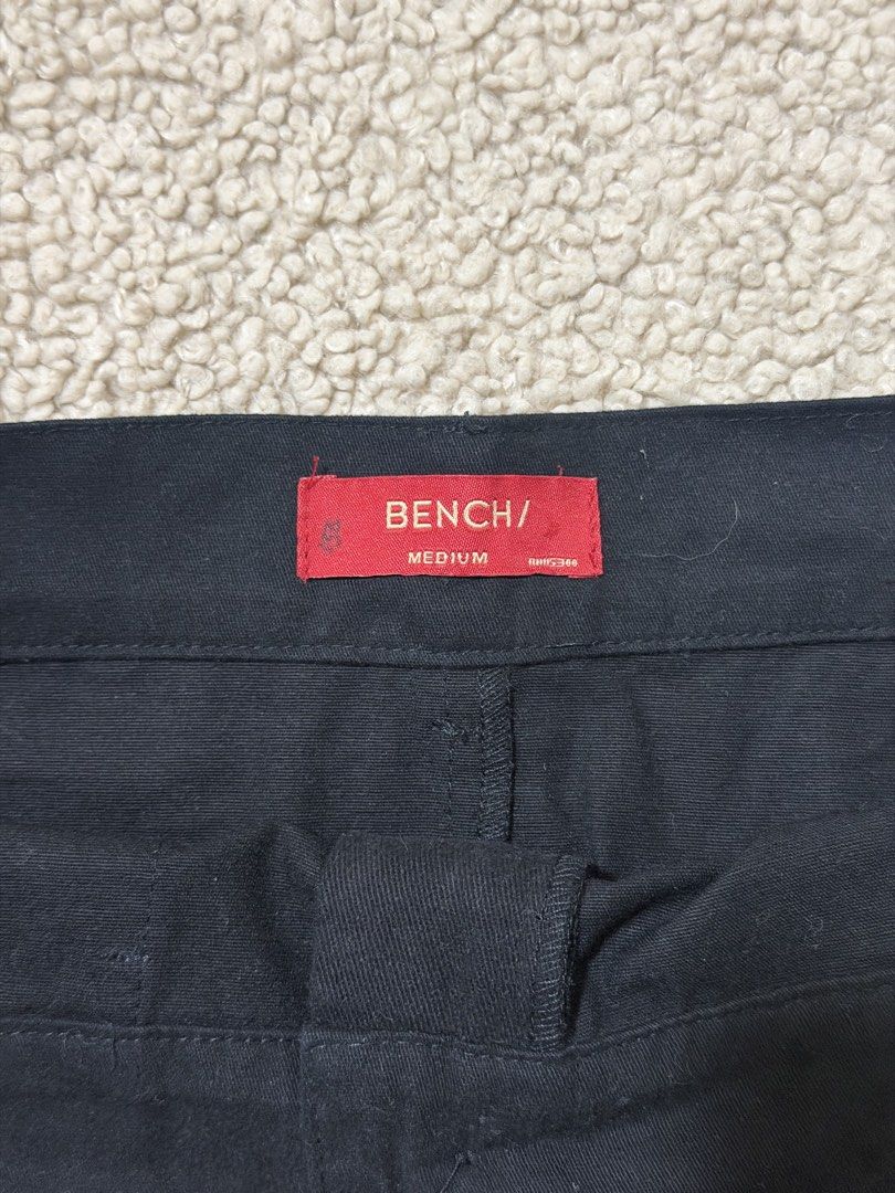 Bench Black Midi Skirt Size Medium (Category: Skirts) located in Las Pinas. Submitted by ann.co. (Listing ID 1469544548, Image 3). Description: - Brand: Bench - Size: Medium - Color: Classic Black - Style: Straight cut midi skirt - Details: Front button closure, belt loops, two deep front pockets, and a back slit hem - Condition: Great staple piece - Versatility: Perfect for both casual outings and office wear.