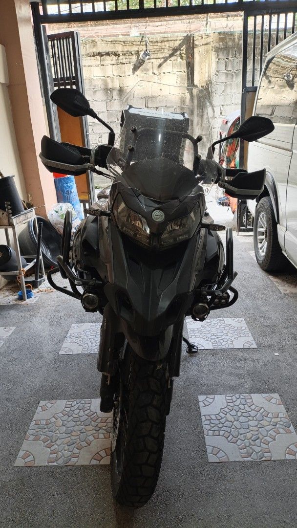 Benelli TRK 502X Motorcycle Gray with Top Box (Category: Motorbikes for Sale) located in Manila. Submitted by whatyouwantiswhatwehave. (Listing ID 1469399851, Image 3). Description: Benelli TRK 502X adventure motorcycle in gray. 2023 model. Includes rear top box, crash bars, auxiliary lights, and handguards. Spoke wheels, large windscreen, and rear mudguard attached. Registered under private classification. LTO documents complete. Well maintained