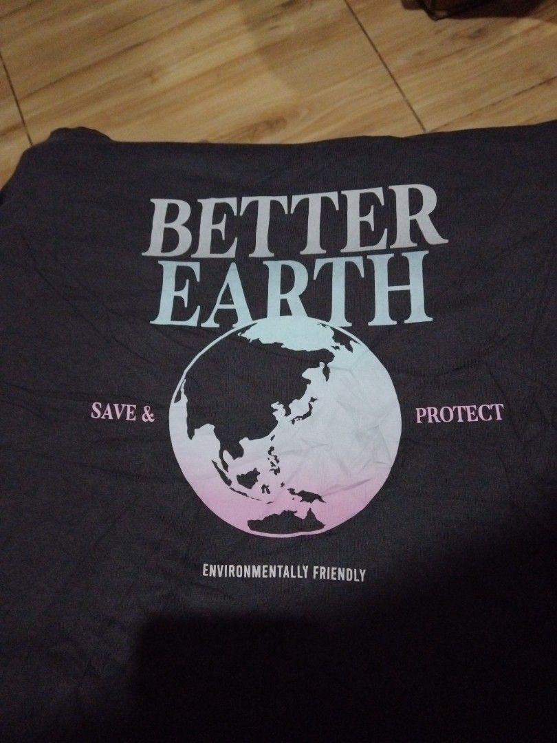 Better earth t-shirt (Category: Shirts) located in Caloocan City. Submitted by mysticdeer_4b2e50 (Listing ID 1469536065, Image 3). Description: - Brand: Topten - Item: 'Better Earth' Graphic T-Shirt - Color: Dark Gray - Size: Medium (105cm chest) - Design: Front print featuring the earth graphic with 'Save & Protect - Environmentally Friendly' text - Condition: Good, well-maintained pre-loved item - Material: 100% cotton (as indicated on the tag)
