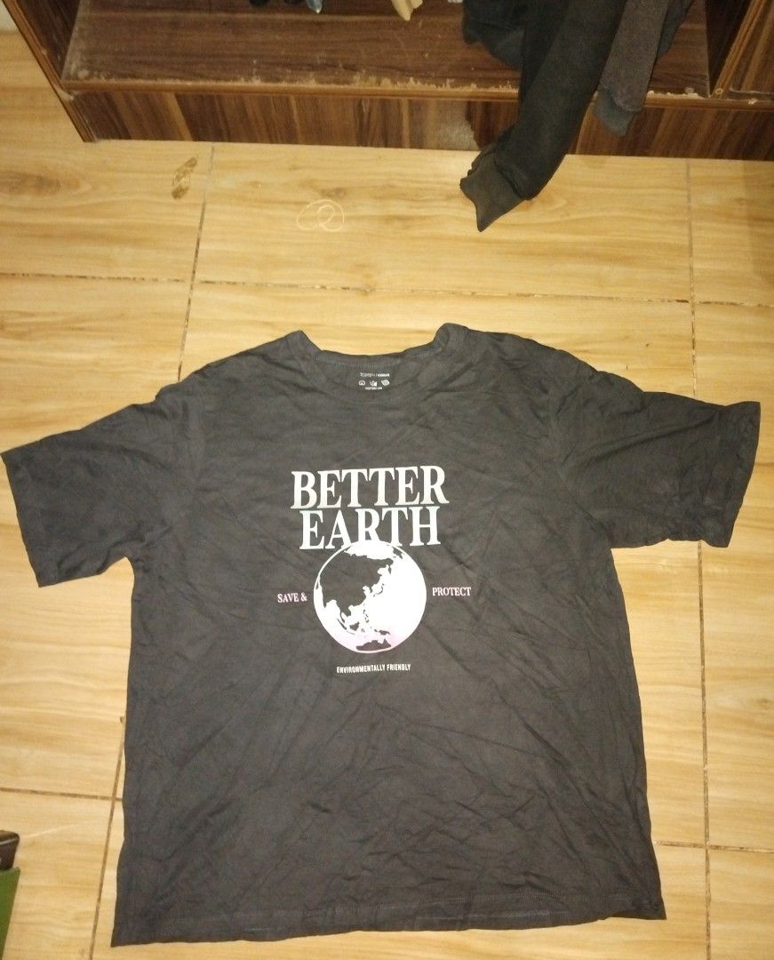 Better earth t-shirt (Category: Shirts) located in Caloocan City. Submitted by mysticdeer_4b2e50 (Listing ID 1469536065, Image 1). Description: - Brand: Topten - Item: 'Better Earth' Graphic T-Shirt - Color: Dark Gray - Size: Medium (105cm chest) - Design: Front print featuring the earth graphic with 'Save & Protect - Environmentally Friendly' text - Condition: Good, well-maintained pre-loved item - Material: 100% cotton (as indicated on the tag)