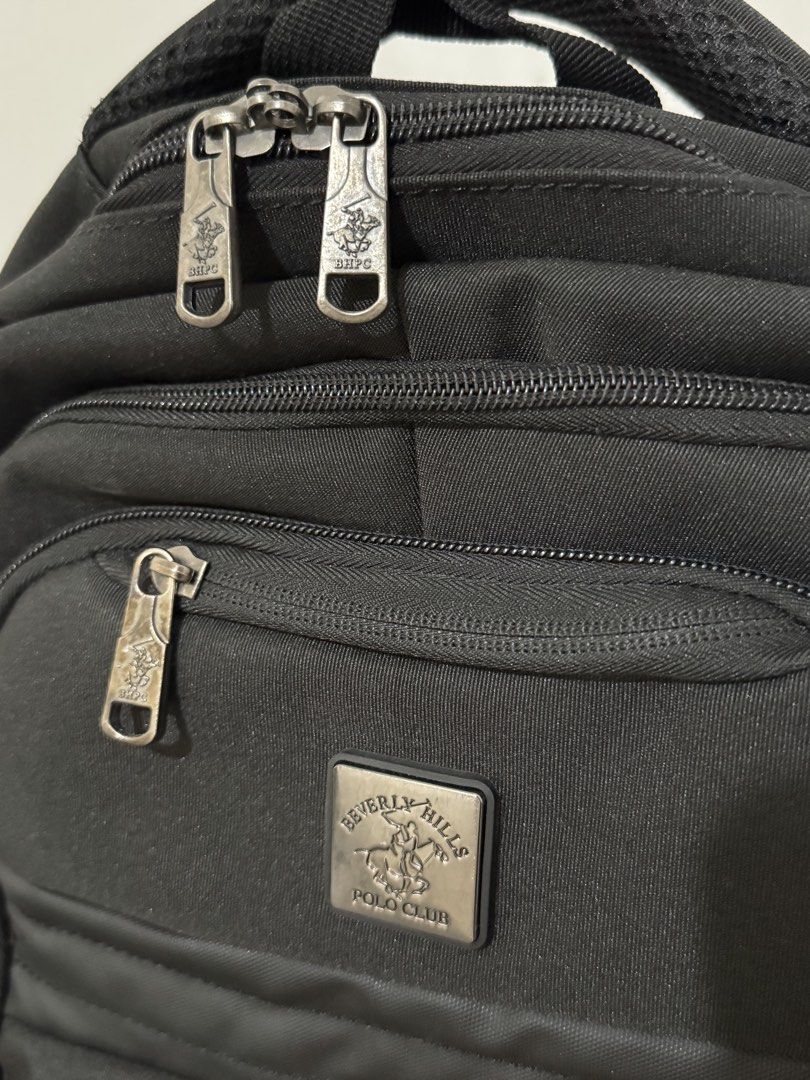 Beverly Hills Polo Club Black Backpack (Category: Backpacks) located in Paranaque City. Submitted by shopdecalidad (Listing ID 1469438648, Image 2). Description: - Brand: Beverly Hills Polo Club - Color: Classic Black - Multiple secure zippered compartments and interior organizer slots - Breathable mesh padding on the back and shoulder straps for all-day comfort - Convenient side mesh pockets for water bottles - Durable top handle and solid, stur