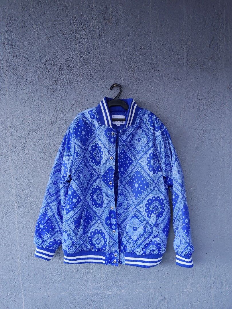 BIG FOR SAM Blue Bandana Print Bomber Varsity Jacket (Category: Coats, Jackets and Outerwear) located in Manila. Submitted by juanpablor51788 (Listing ID 1469490125, Image 1). Description: - Style: Bold street style royal blue jacket - Print: All-over classic bandana paisley print - Closure: Snap button front - Trim: Striped ribbed collar, cuffs, and hem - Comfort: Quilted inner lining for extra warmth - Size: XXL -best fit to xl .