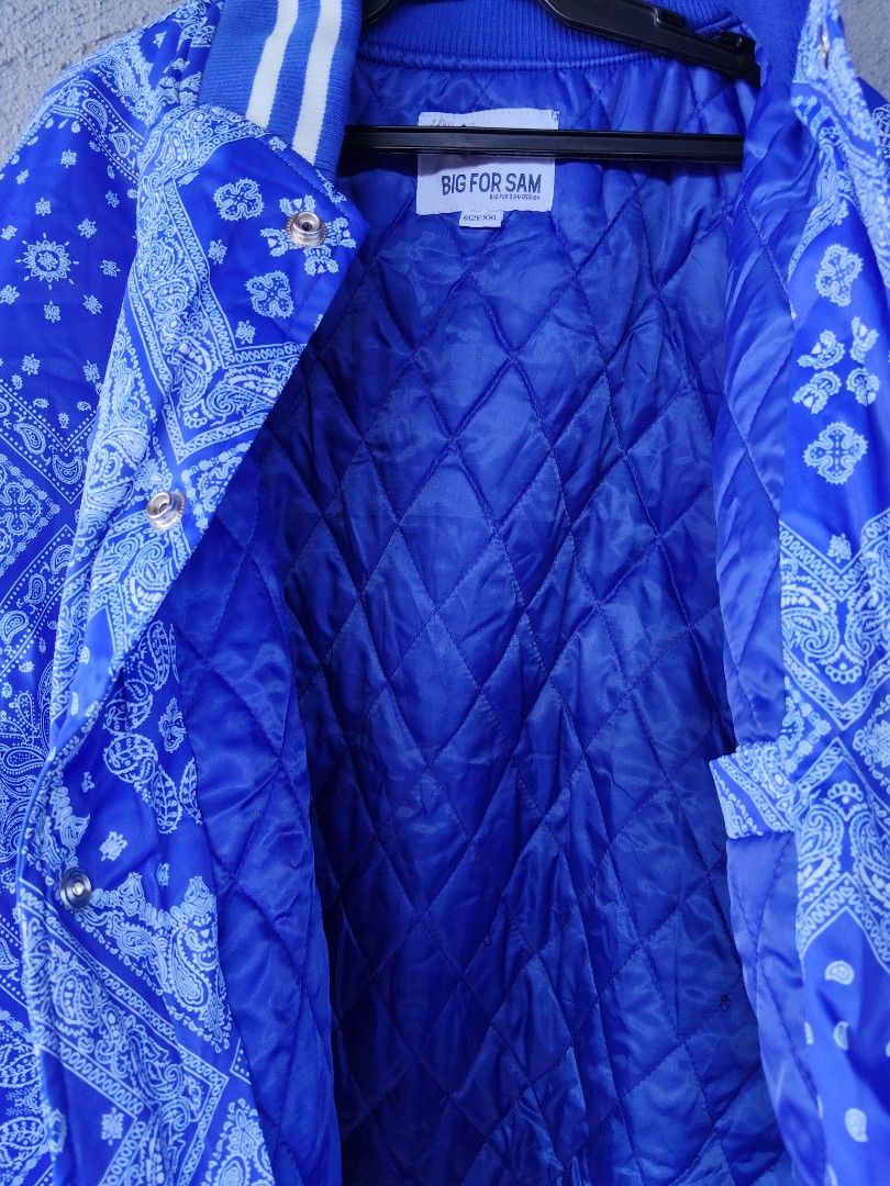 BIG FOR SAM Blue Bandana Print Bomber Varsity Jacket (Category: Coats, Jackets and Outerwear) located in Manila. Submitted by juanpablor51788 (Listing ID 1469490125, Image 3). Description: - Style: Bold street style royal blue jacket - Print: All-over classic bandana paisley print - Closure: Snap button front - Trim: Striped ribbed collar, cuffs, and hem - Comfort: Quilted inner lining for extra warmth - Size: XXL -best fit to xl .