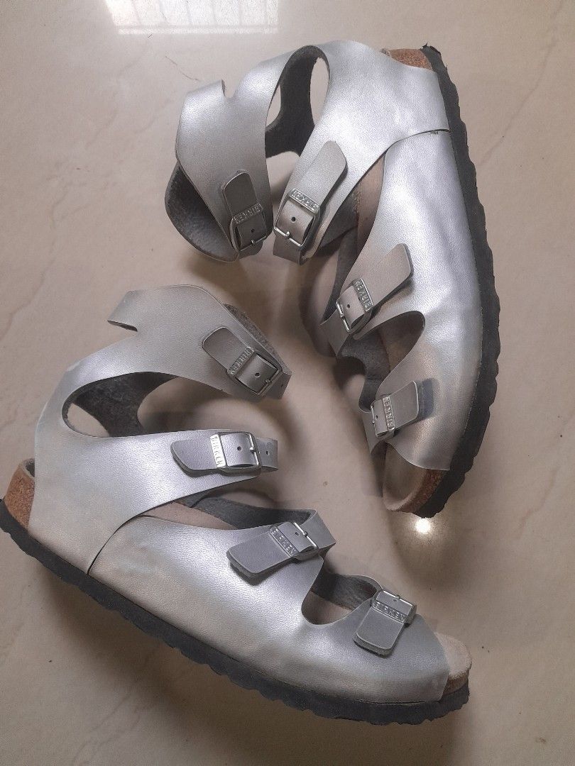 Birkenstock Silver Strappy Sandals (Category: Flats & Sandals) located in Calasiao. Submitted by pj_ulanday051184 (Listing ID 1469409399, Image 1). Description: - Style: Silver Birkenstock sandals with ankle support - Straps: Multiple adjustable buckle straps with classic branding - Materials: Soft suede footbed, supportive cork midsole, and textured black rubber outsole - Condition: Excellent / Well-maintained - Best for: Warm weather outings, c