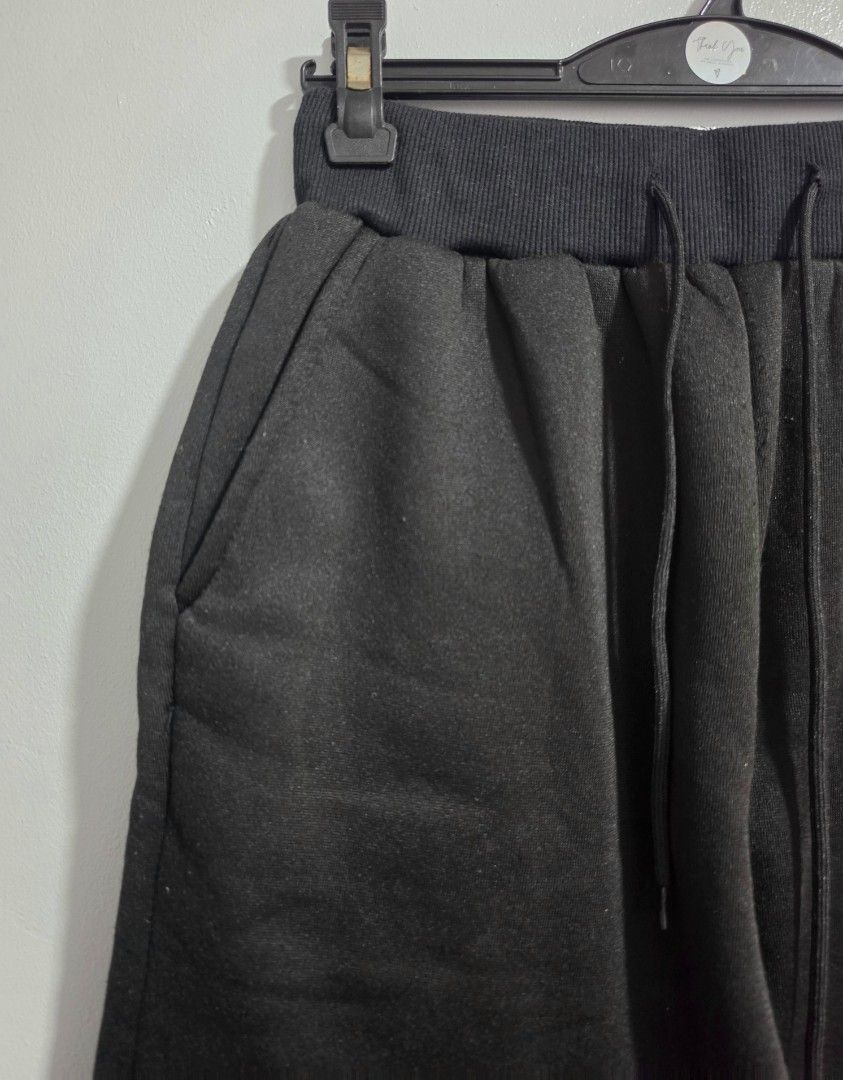 Black Chicago Graphic Sweatpants Joggers (Category: Jeans) located in Paranaque City. Submitted by franinnashop (Listing ID 1469459101, Image 3). Description: Declutter - Style: Casual streetwear black sweatpants with white Chicago gothic text on the left leg - Comfort: Soft fleece fabric inside, perfect for everyday wear - Features: Thick elastic waistband with adjustable drawstring cords and deep side pockets - Measurements: Waist 24 to 34 inch