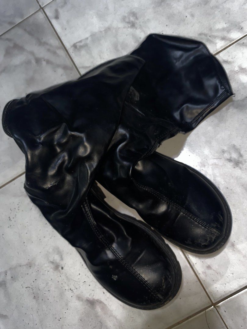 Black chunky platform mid-calf boots with zipper (Category: Boots) located in Pasig City. Submitted by six_seven67 (Listing ID 1469542713, Image 1). Description: - Color: Black - Style: Mid-calf boots with slouchy shafts, thick chunky heels, and heavy lug soles - Closure: Full-length back zippers - Material: Faux leather - Condition: Flawed - visible scuffs and scratches on toes and heels, with noticeable material peeling and damage on the upper 
