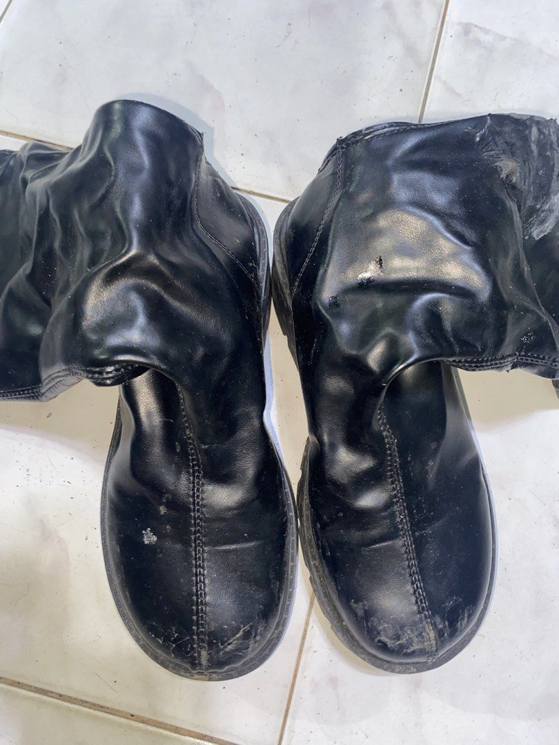 Black chunky platform mid-calf boots with zipper (Category: Boots) located in Pasig City. Submitted by six_seven67 (Listing ID 1469542713, Image 2). Description: - Color: Black - Style: Mid-calf boots with slouchy shafts, thick chunky heels, and heavy lug soles - Closure: Full-length back zippers - Material: Faux leather - Condition: Flawed - visible scuffs and scratches on toes and heels, with noticeable material peeling and damage on the upper 