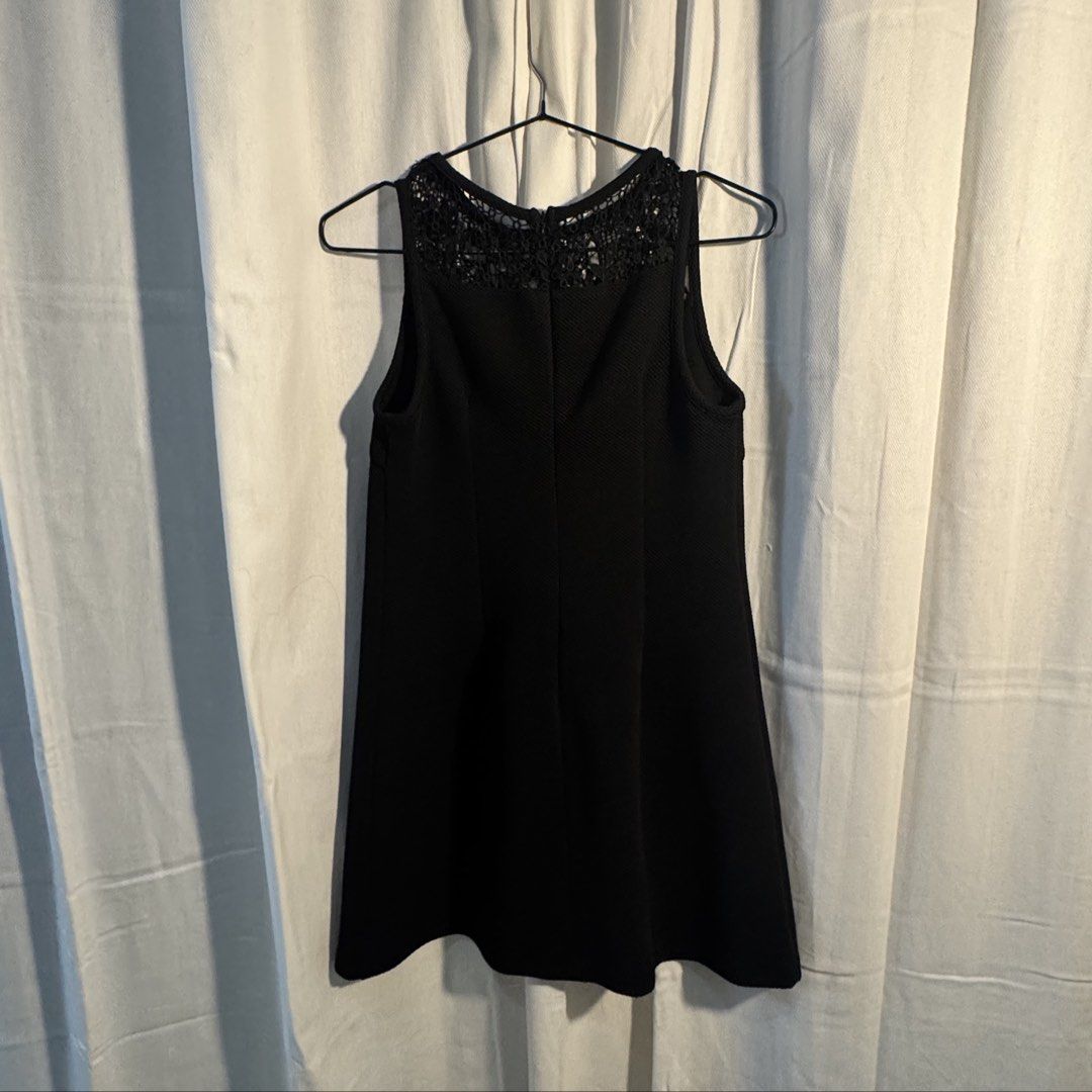 Black Dress (Category: Dresses) located in Marikina City. Submitted by repurpose_studio (Listing ID 1469507148, Image 1). Description: - Color: Black - Bought Original Price at ₱1,650 - Size: Small Waist: 33” Dress length from shoulder: 30” - Style: Sleeveless swing dress, hits above the knee - Details: Intricate crochet lace yoke at neckline and upper back, textured fabric - Closure: Back zipper - Occasion: Perfect for casual outings or dressing