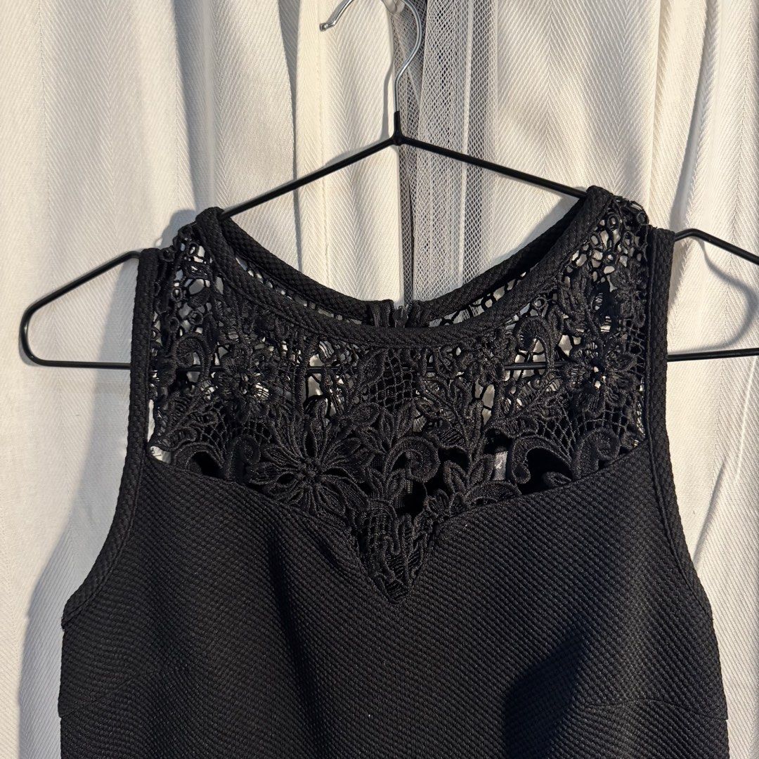 Black Dress (Category: Dresses) located in Marikina City. Submitted by repurpose_studio (Listing ID 1469507148, Image 2). Description: - Color: Black - Bought Original Price at ₱1,650 - Size: Small Waist: 33” Dress length from shoulder: 30” - Style: Sleeveless swing dress, hits above the knee - Details: Intricate crochet lace yoke at neckline and upper back, textured fabric - Closure: Back zipper - Occasion: Perfect for casual outings or dressing