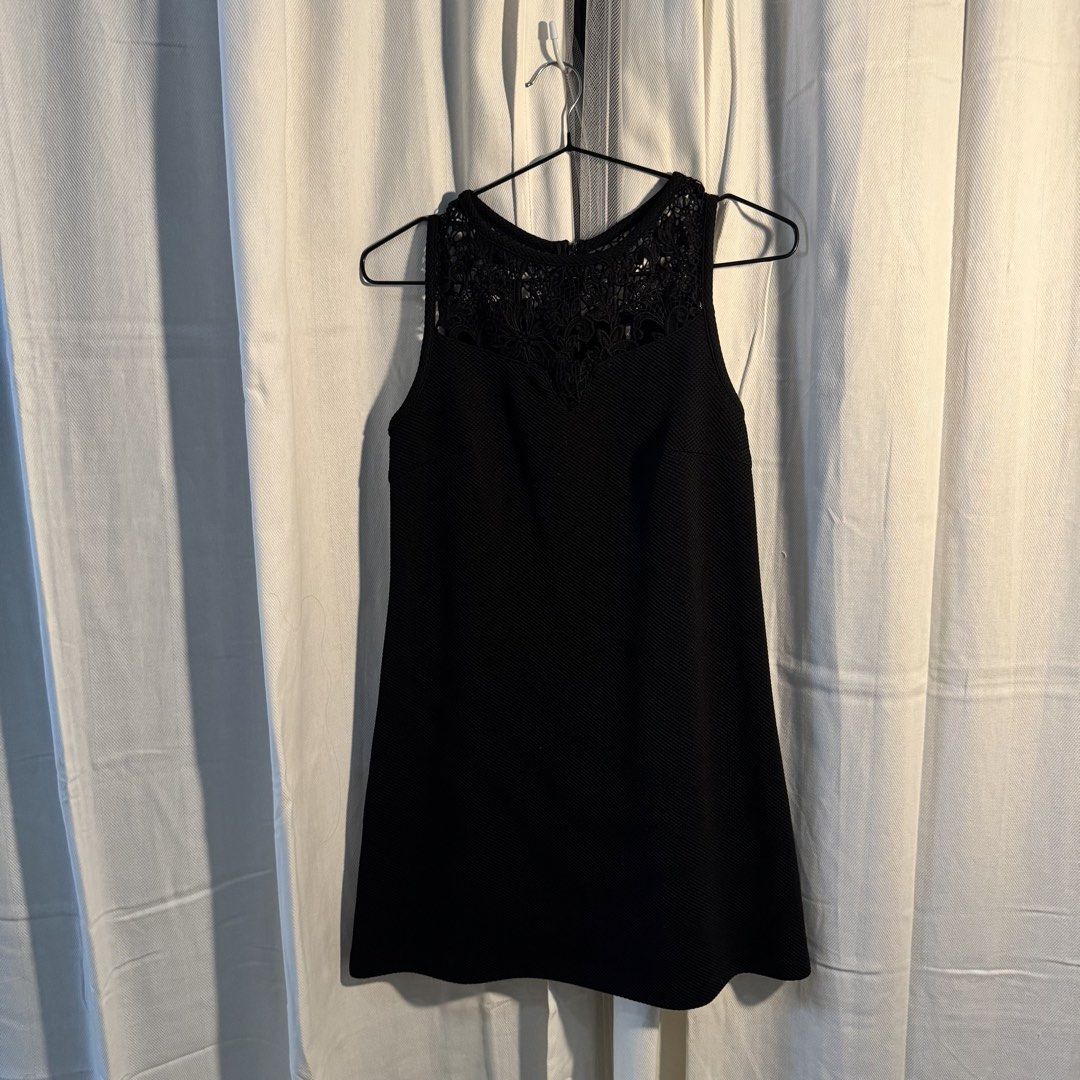 Black Dress (Category: Dresses) located in Marikina City. Submitted by repurpose_studio (Listing ID 1469507148, Image 3). Description: - Color: Black - Bought Original Price at ₱1,650 - Size: Small Waist: 33” Dress length from shoulder: 30” - Style: Sleeveless swing dress, hits above the knee - Details: Intricate crochet lace yoke at neckline and upper back, textured fabric - Closure: Back zipper - Occasion: Perfect for casual outings or dressing