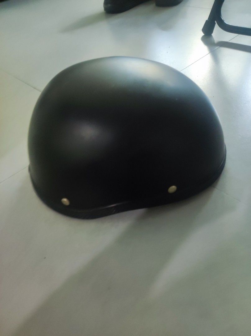 Black half shell motorcycle helmet (Category: Caps & Hats) located in Pasay City. Submitted by wizemindz138970 (Listing ID 1469426326, Image 2). Description: - Color: Matte black - Type: Half shell helmet - Condition: Minimal exterior wear, very clean interior padding - Features: Standard strap, quick-release buckle, and chin cup - Ideal for: Daily commutes and rides 399.