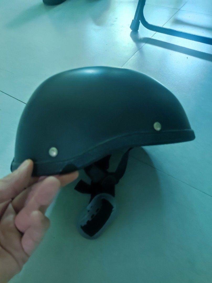 Black half shell motorcycle helmet (Category: Caps & Hats) located in Pasay City. Submitted by wizemindz138970 (Listing ID 1469426326, Image 1). Description: - Color: Matte black - Type: Half shell helmet - Condition: Minimal exterior wear, very clean interior padding - Features: Standard strap, quick-release buckle, and chin cup - Ideal for: Daily commutes and rides 399.