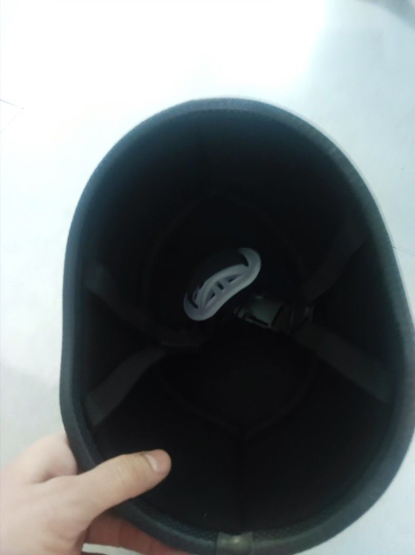 Black half shell motorcycle helmet (Category: Caps & Hats) located in Pasay City. Submitted by wizemindz138970 (Listing ID 1469426326, Image 3). Description: - Color: Matte black - Type: Half shell helmet - Condition: Minimal exterior wear, very clean interior padding - Features: Standard strap, quick-release buckle, and chin cup - Ideal for: Daily commutes and rides 399.