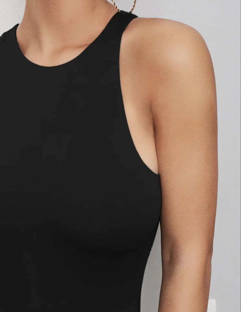 Black High Neck Racerback Bodysuit (Category: Sleeveless) located in Pasig City. Submitted by closetcleanoutmnl (Listing ID 1469514399, Image 2). Description: - Color: Solid black - Style: Racerback bodysuit with a high neckline and fitted silhouette - Features: Sleeveless design, smooth stretch fabric, and bottom snaps for convenience - Versatility: Perfect minimalist basic to pair with jeans, skirts, or shorts - fits medium to large frame - str