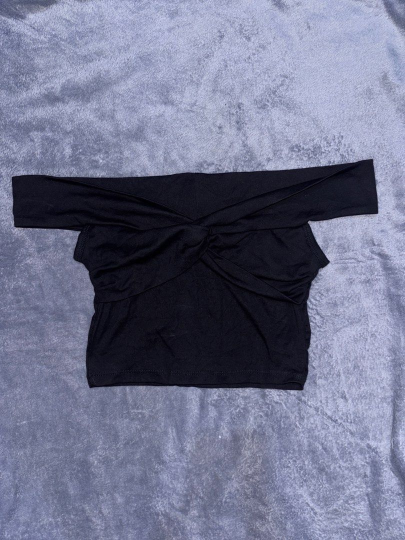 Black off-shoulder crop top (Category: Sleeveless) located in San Pedro. Submitted by classychic.couture (Listing ID 1469538786, Image 2). Description: - Small - Medium (suitable for broad shoulders) - Two-way top (off shoulder and tank top) - Good as new with tag - No issues.