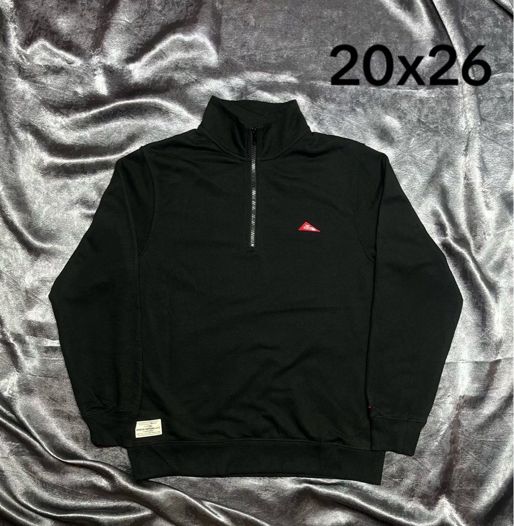 Black Quarter Zip Sweatshirt 20x26 (Category: Coats, Jackets and Outerwear) located in Cavite. Submitted by bellewii (Listing ID 1469528381, Image 1). Description: - Color: Black - Style: Quarter zip sweatshirt with high neck collar and metal zipper - Branding: Small red triangle logo on right chest and woven label near bottom hem - Details: Ribbed cuffs and waistband - Size/Measurements: 20 inches width x 26 inches length.