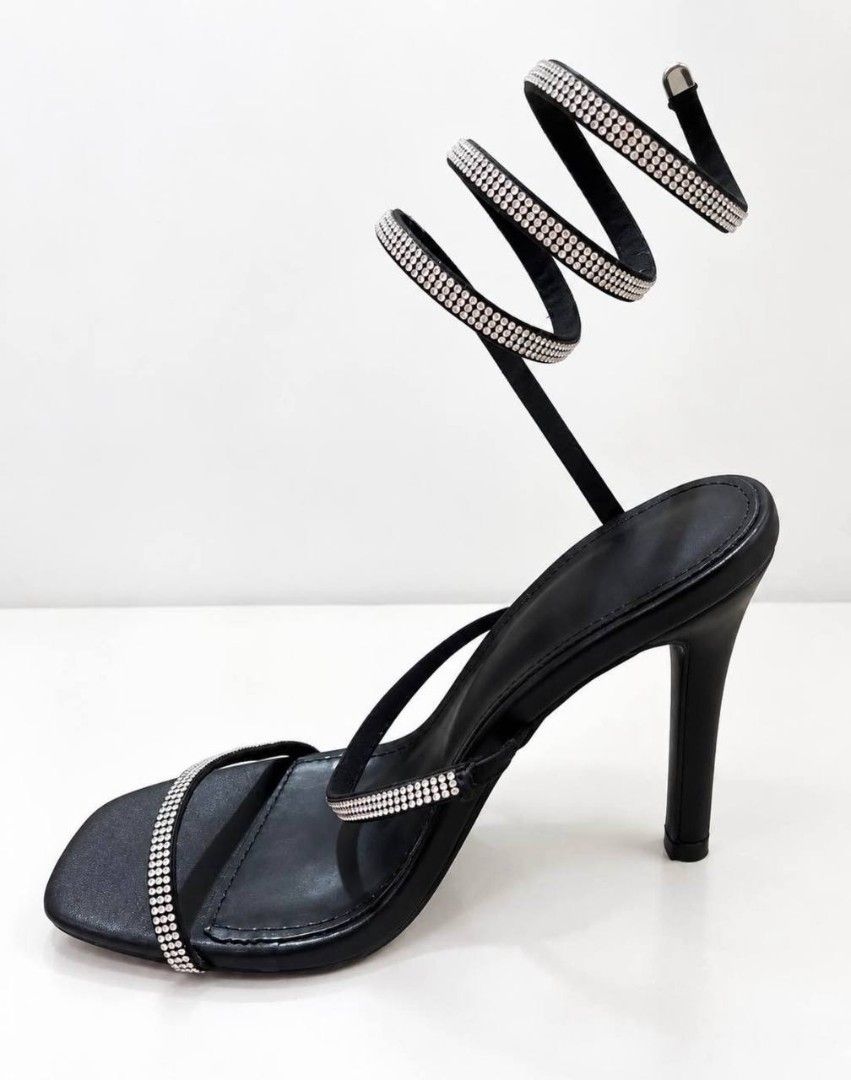 Black Rhinestone Spiral Strap High Heels (Category: Heels) located in Cagayan de Oro. Submitted by micaverzosa30 (Listing ID 1469554266, Image 2). Description: - Style: Black high heels with thin stiletto heel and square open toe - Design: Eye-catching rhinestone-covered wrap-around straps with a flexible spiral coil - Fit: Slip-on style that climbs comfortably up the lower leg - Occasion: Perfect for nights out, parties, dates, and special event