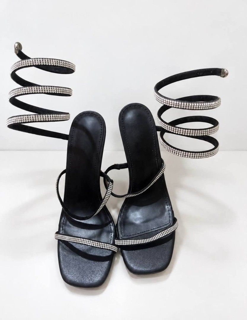 Black Rhinestone Spiral Strap High Heels (Category: Heels) located in Cagayan de Oro. Submitted by micaverzosa30 (Listing ID 1469554266, Image 1). Description: - Style: Black high heels with thin stiletto heel and square open toe - Design: Eye-catching rhinestone-covered wrap-around straps with a flexible spiral coil - Fit: Slip-on style that climbs comfortably up the lower leg - Occasion: Perfect for nights out, parties, dates, and special event