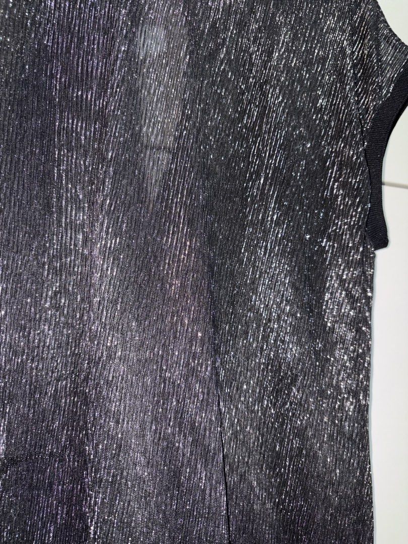 Black Silver Metallic Shimmer Open Back Blouse Top (Category: Blouses) located in Siquijor. Submitted by yhostuff (Listing ID 1469498722, Image 2). Description: - Color & Detail: Black with woven silver shimmer threads - Design: Short cap sleeves, ribbed neckline/cuffs/hem, and back overlap wrap with teardrop cutout - Fabric: Lightweight and semi-sheer - Style: Perfect going-out top for parties and dates 📌 great for evening event /night out. .