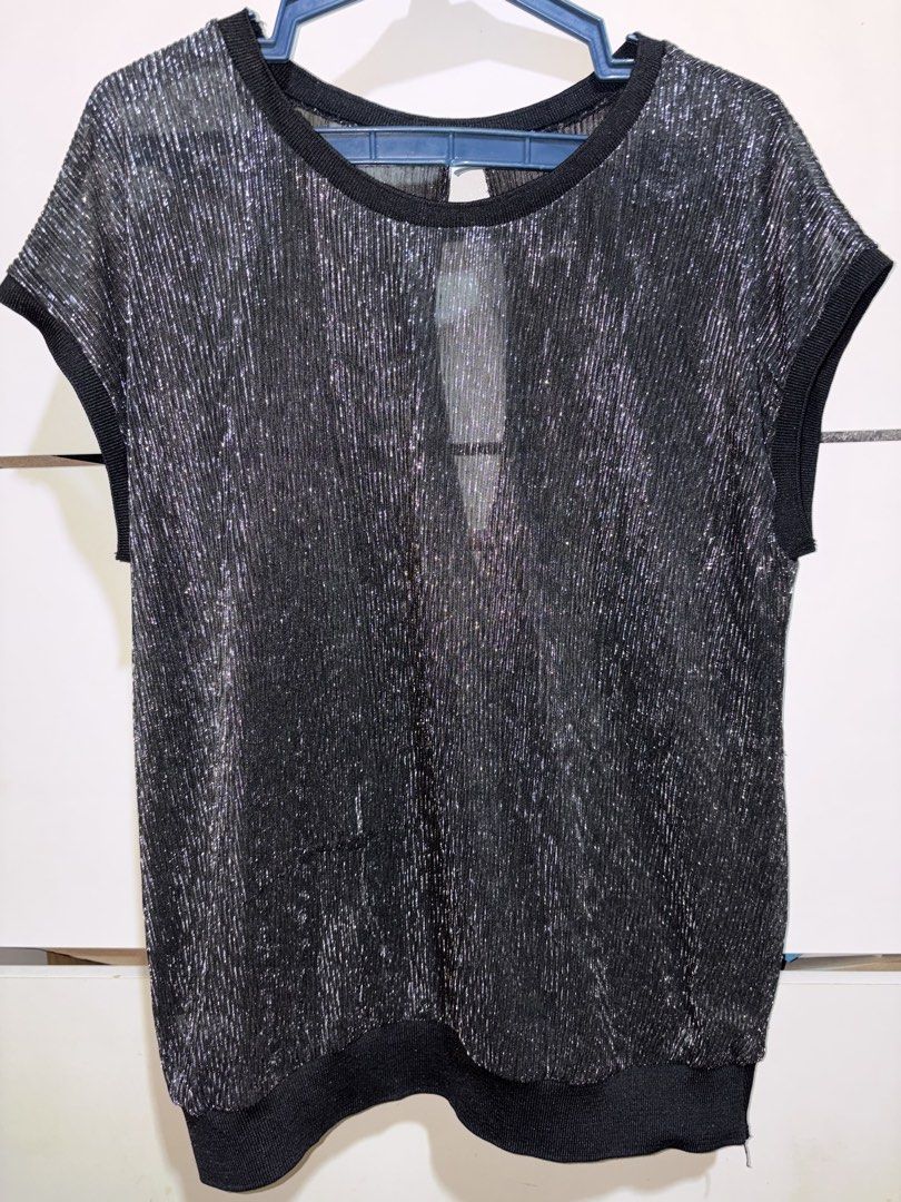 Black Silver Metallic Shimmer Open Back Blouse Top (Category: Blouses) located in Siquijor. Submitted by yhostuff (Listing ID 1469498722, Image 1). Description: - Color & Detail: Black with woven silver shimmer threads - Design: Short cap sleeves, ribbed neckline/cuffs/hem, and back overlap wrap with teardrop cutout - Fabric: Lightweight and semi-sheer - Style: Perfect going-out top for parties and dates 📌 great for evening event /night out. .
