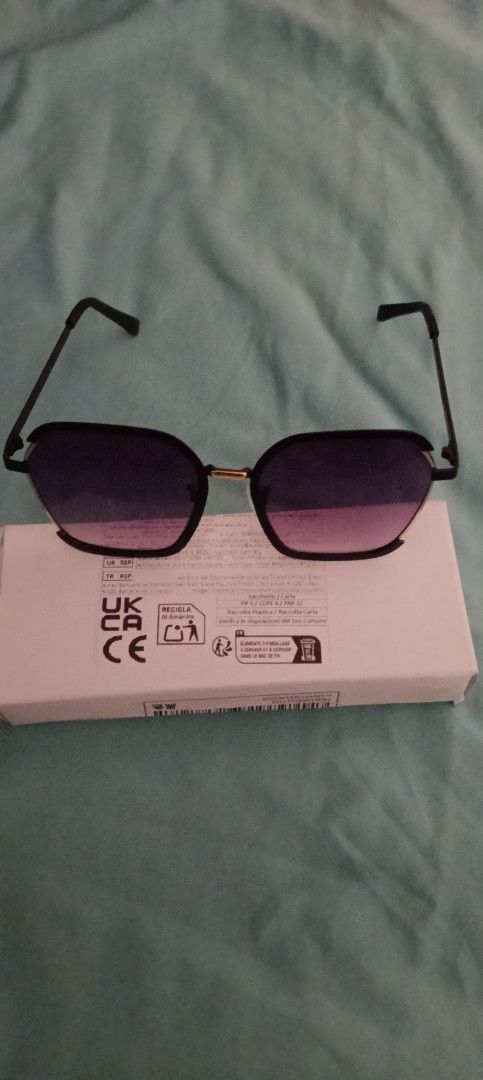 Black Square Sunglasses with Gradient Lenses and Box (Category: Sunglasses & Eyewear) located in Taguig. Submitted by trade_fairly (Listing ID 1469422524, Image 3). Description: - Style: Black square sunglasses with slim metal arms - Lenses: Trendy gradient lenses for everyday wear - Details: Elegant gold accent piece on the bridge - Condition/Inclusions: Brand new feel, includes original white packaging box with barcode and regulatory markings -