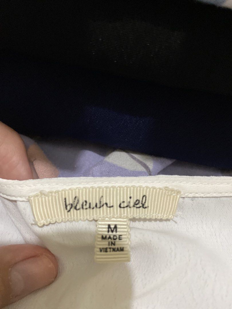 Bleu Ciel White V-Neck Blouse Size M (Category: Blouses) located in Pasig City. Submitted by alaineeeee (Listing ID 1469513224, Image 2). Description: - Brand: Bleu Ciel - Size: Medium - Color: White - Style: V-neck with flared sleeves and peplum hem - Details: Adjustable front drawstring and ties - Material: Light and flowy fabric - Origin: Made in Vietnam - Versatile: Great for casual outings or office wear.