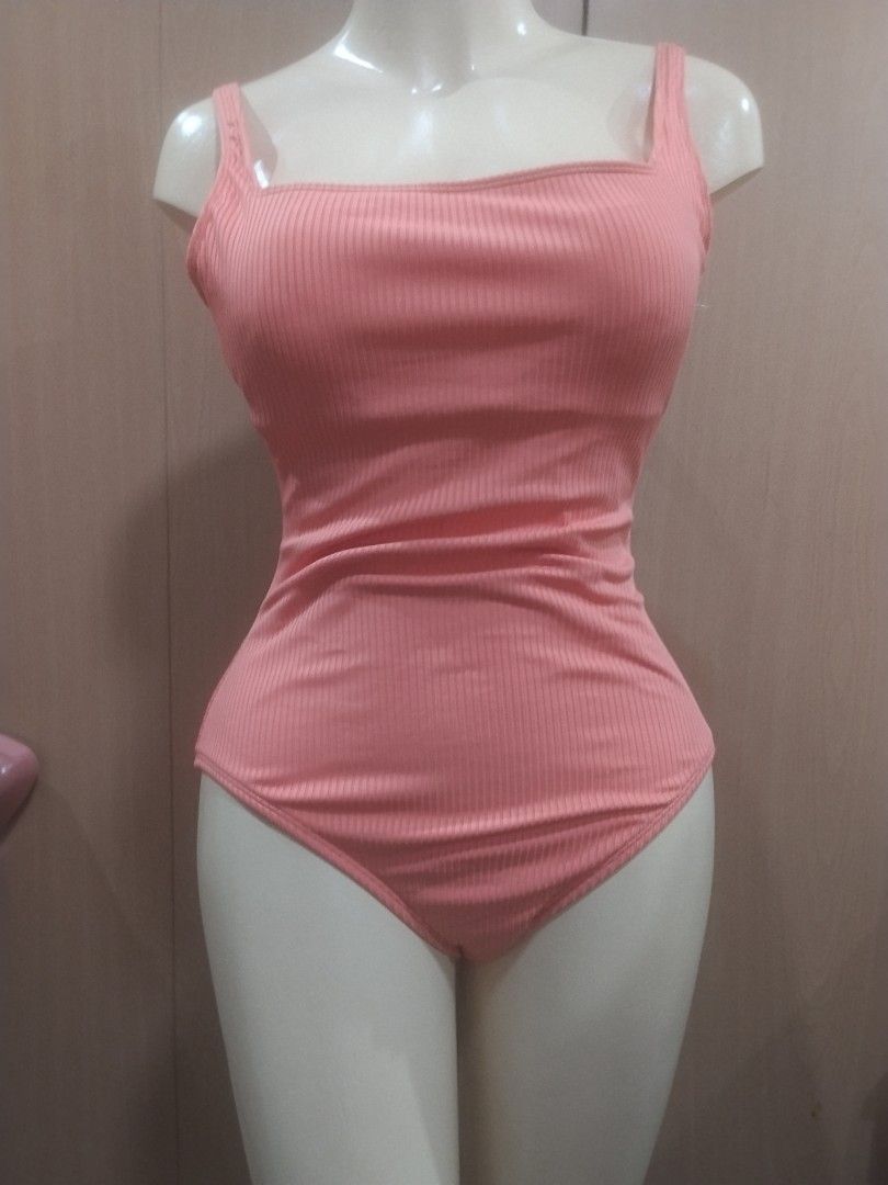 BLEU Ribbed Peach One-Piece Swimsuit (Category: Bikinis & Swimsuits) located in Manila. Submitted by ajrswimwear (Listing ID 1469556489, Image 1). Description: Peach one-piece swimsuit by BLEU. Ribbed texture all over with a square neckline and thick straps. Gold-tone hardware detail stamped with the brand logo on the back strap. High-cut leg design..