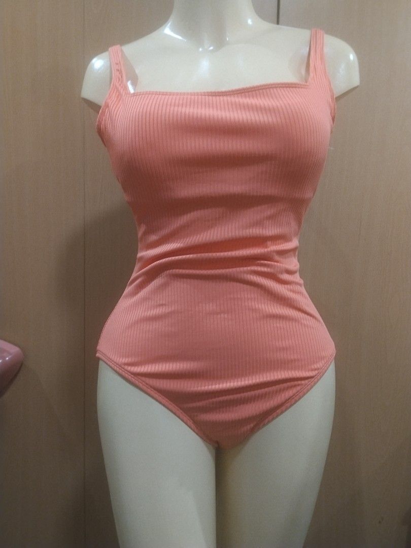 BLEU Ribbed Peach One-Piece Swimsuit (Category: Bikinis & Swimsuits) located in Manila. Submitted by ajrswimwear (Listing ID 1469556489, Image 2). Description: Peach one-piece swimsuit by BLEU. Ribbed texture all over with a square neckline and thick straps. Gold-tone hardware detail stamped with the brand logo on the back strap. High-cut leg design..