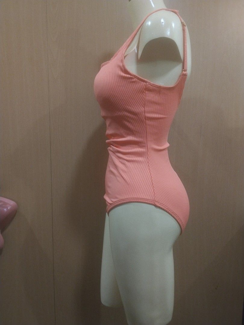 BLEU Ribbed Peach One-Piece Swimsuit (Category: Bikinis & Swimsuits) located in Manila. Submitted by ajrswimwear (Listing ID 1469556489, Image 3). Description: Peach one-piece swimsuit by BLEU. Ribbed texture all over with a square neckline and thick straps. Gold-tone hardware detail stamped with the brand logo on the back strap. High-cut leg design..