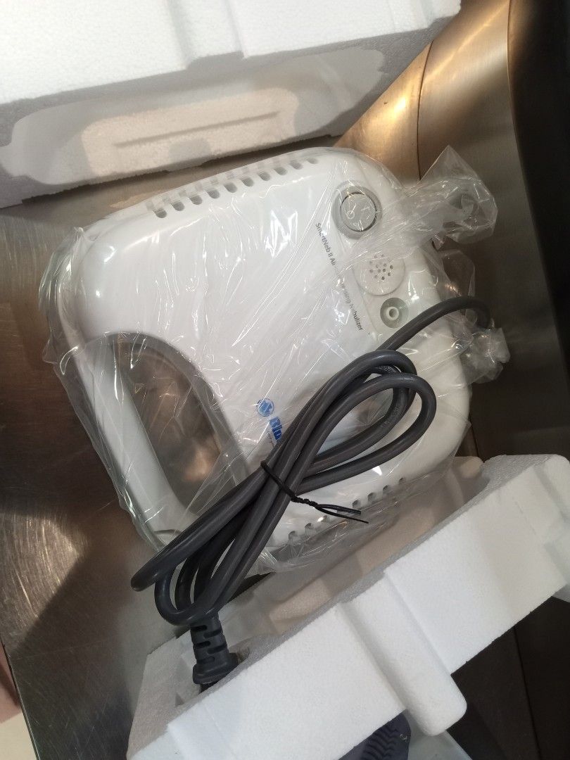 Blue Cross SmartNeb II Air Compressing Nebulizer (Category: Medical Supplies & Tools) located in Manila. Submitted by happyhawk.fb94fe (Listing ID 1469556256, Image 2). Description: - Brand: Blue Cross SmartNeb II air compressing nebulizer - Condition: Complete set, unused, box opened only to check contents - Includes: Main unit wrapped in plastic, user manual, and warranty card - Accessories: Complete tubing and mask parts included - Bonus: Free