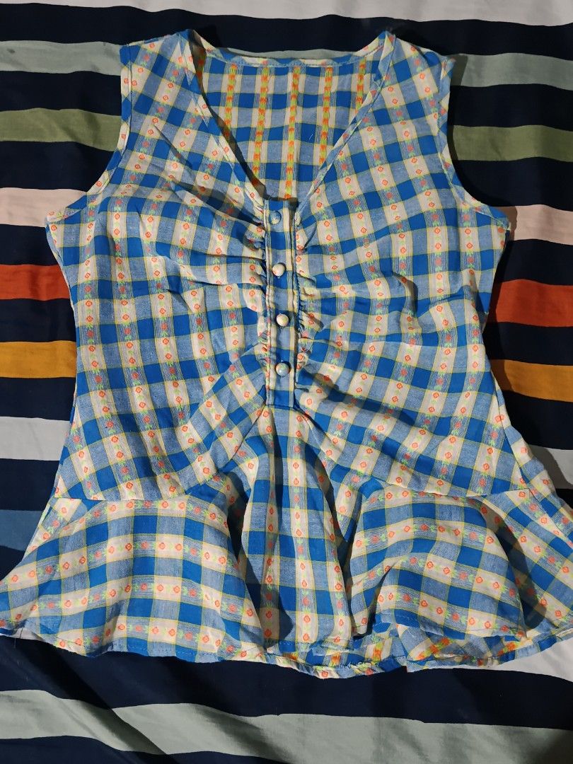 Blue Plaid Peplum Sleeveless Blouse Top (Category: Sleeveless) located in Pasay City. Submitted by angeldollx (Listing ID 1469484964, Image 1). Description: 💮 Blue and white plaid with cute mini floral prints inside the grid 💮 THIN and lightweight fabric 💮 Small - Medium 💮 NO FLAWS!.