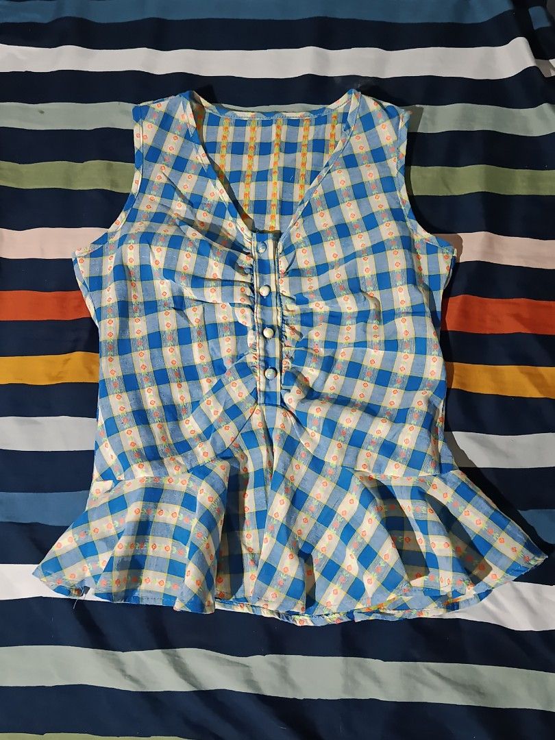 Blue Plaid Peplum Sleeveless Blouse Top (Category: Sleeveless) located in Pasay City. Submitted by angeldollx (Listing ID 1469484964, Image 2). Description: 💮 Blue and white plaid with cute mini floral prints inside the grid 💮 THIN and lightweight fabric 💮 Small - Medium 💮 NO FLAWS!.