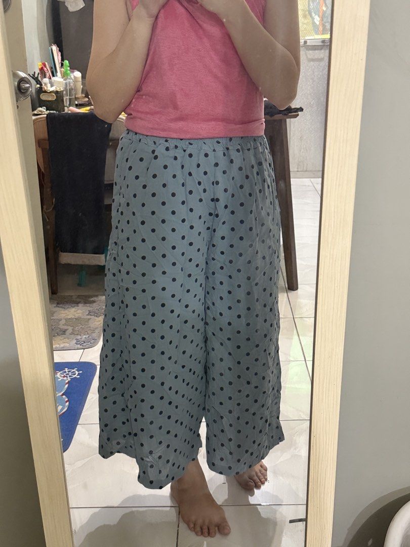 Blue polka dot wide leg cropped pants (Category: Jeans) located in Cagayan de Oro. Submitted by ninaaam (Listing ID 1469430622, Image 2). Description: - Color/Pattern: Light blue with all-over dark blue polka dots - Fit: Relaxed silhouette with an easy pull-on elastic waistband - Length: Cropped (hits around the lower calf) - Material: Lightweight and flowy - Best for: Warm weather and casual home lounging.