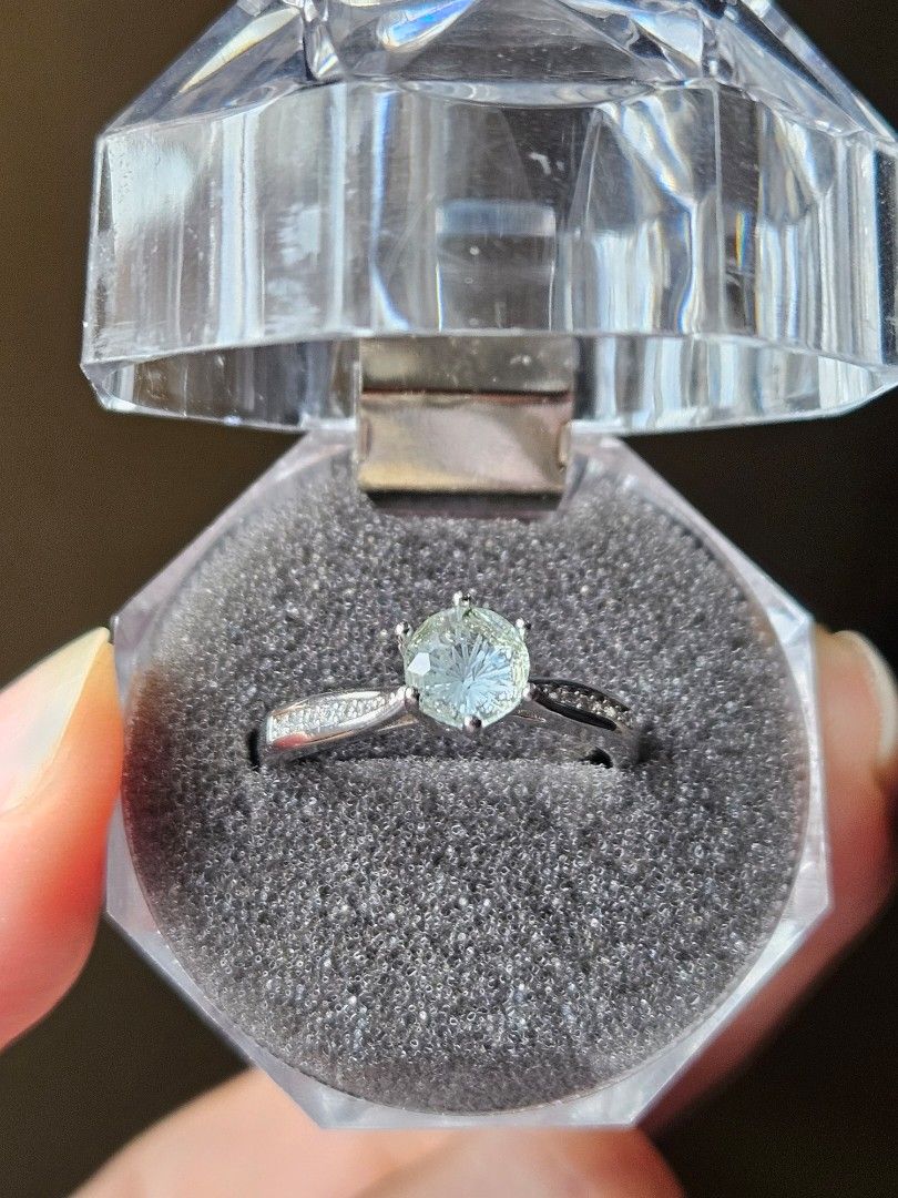 Blue Topaz Silver Plated Ring (Category: Rings) located in Quezon City. Submitted by slipcattt (Listing ID 1469419174, Image 1). Description: - Silver plated ring with a natural Blue Topaz center stone - Adjustable size - Includes a clear hexagonal plastic storage case with grey foam insert for safe keeping.