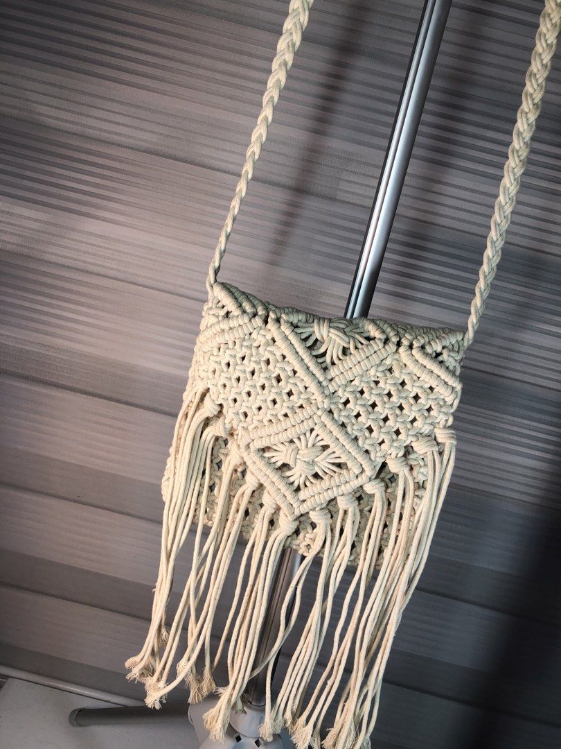 Boho Macrame Crossbody Bag with Fringe (Category: Cross-body Bags) located in Manila. Submitted by all.dressed.up (Listing ID 1469491129, Image 3). Description: Style: Casual boho beige macrame crossbody bag Details: Handcrafted woven knot pattern with stylish front fringe Strap: Comfortable braided shoulder strap Closure & Interior: Secure top zipper with fabric lining Size: Compact and handy for everyday essentials and summer outfits *Manage an