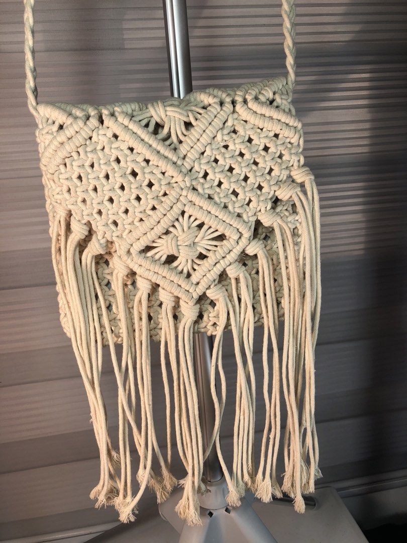 Boho Macrame Crossbody Bag with Fringe (Category: Cross-body Bags) located in Manila. Submitted by all.dressed.up (Listing ID 1469491129, Image 2). Description: Style: Casual boho beige macrame crossbody bag Details: Handcrafted woven knot pattern with stylish front fringe Strap: Comfortable braided shoulder strap Closure & Interior: Secure top zipper with fabric lining Size: Compact and handy for everyday essentials and summer outfits *Manage an