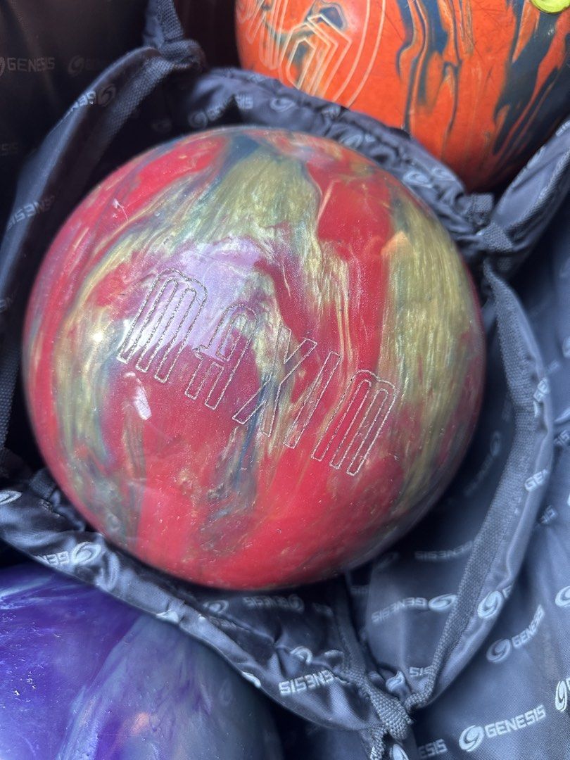 Bowling set (Category: Billiards and Bowling) located in Caloocan City. Submitted by jhk2922 (Listing ID 1469400586, Image 2). Description: - Genesis 3-ball roller bag with smooth-working zippers and retractable handle - DV8 Misfit bowling ball (orange and blue) with finger inserts (10lbs) - Maxim bowling ball (red and gold) with finger inserts (11lbs) - Storm Reign On bowling ball (purple and grey) with finger inserts (11lbs) - Normal surface sc