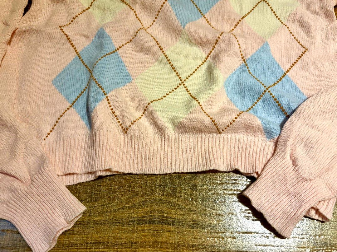 Brandy Melville Pastel Argyle Sweater (Category: Coats, Jackets and Outerwear) located in Marikina City. Submitted by opalineangel (Listing ID 1469545492, Image 3). Description: - Brandy Melville (one size but fits S-M) - Pink, baby blue, and cream with brown stitching - Argyle diamond pattern across the front, crew neck, long sleeves - Ribbed cuffs and hem, soft knit fabric - Classic preppy, cozy, and trendy.