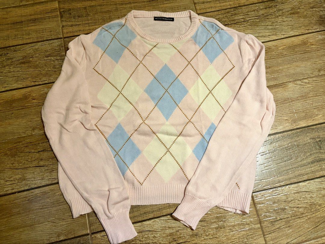 Brandy Melville Pastel Argyle Sweater (Category: Coats, Jackets and Outerwear) located in Marikina City. Submitted by opalineangel (Listing ID 1469545492, Image 1). Description: - Brandy Melville (one size but fits S-M) - Pink, baby blue, and cream with brown stitching - Argyle diamond pattern across the front, crew neck, long sleeves - Ribbed cuffs and hem, soft knit fabric - Classic preppy, cozy, and trendy.