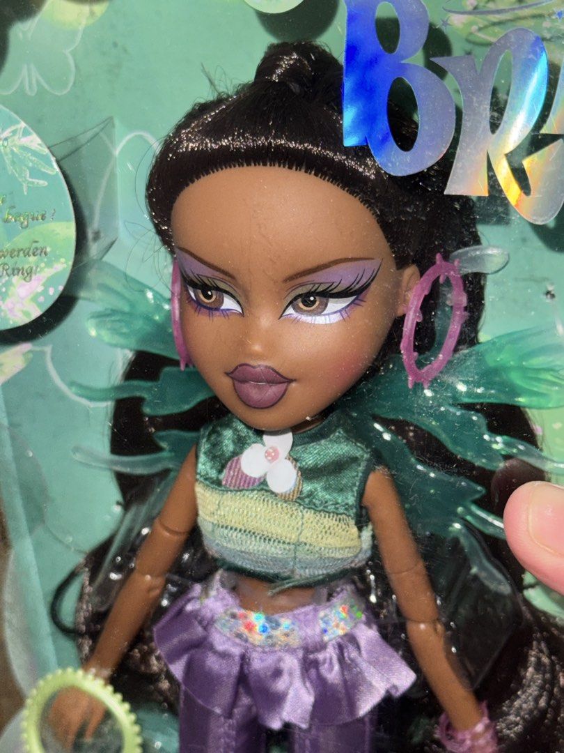 Bratz Fashion Pixiez Fianna Doll (Category: Kids Toys) located in Manila. Submitted by judeo. (Listing ID 1469510252, Image 2). Description: ONHAND☺️💕 ❤️Bratz Fashion Pixiez Fianna Doll❤️ - Condition: Brand New In Box (NIB), unopened original triangular window packaging - Outfit: Green top and purple flared pants - Accessories: Translucent wings, pink hoop earrings, and matching purse - Perfect for collectors and Bratz fans! Fb: judith grey.
