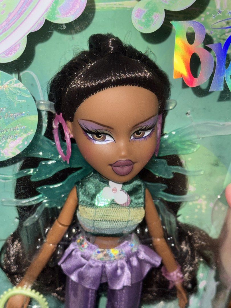 Bratz Fashion Pixiez Fianna Doll (Category: Kids Toys) located in Manila. Submitted by judeo. (Listing ID 1469510252, Image 3). Description: ONHAND☺️💕 ❤️Bratz Fashion Pixiez Fianna Doll❤️ - Condition: Brand New In Box (NIB), unopened original triangular window packaging - Outfit: Green top and purple flared pants - Accessories: Translucent wings, pink hoop earrings, and matching purse - Perfect for collectors and Bratz fans! Fb: judith grey.