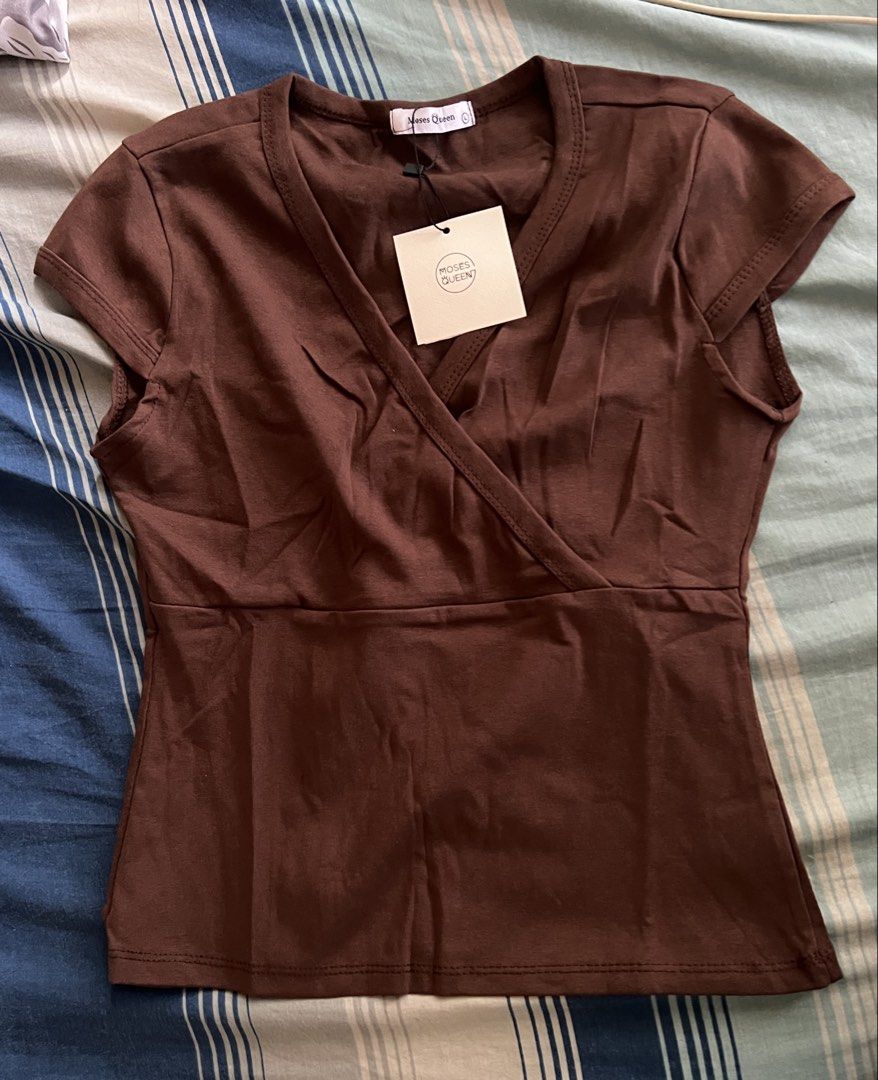brown top (Category: Shirts) located in Cainta. Submitted by moiafits (Listing ID 1469446536, Image 1). Description: size L on tag extra stock.
