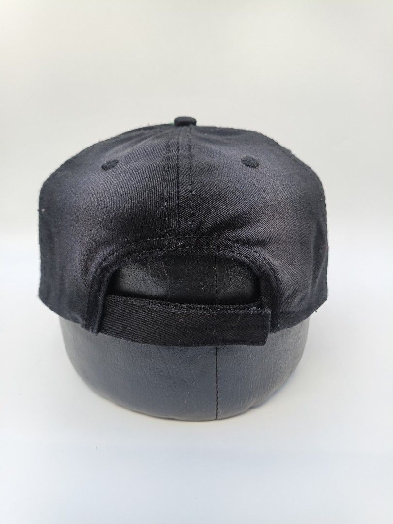 Budweiser St. Patrick's Day Clover Distressed Baseball Cap (Category: Caps & Hats) located in Imus. Submitted by grindhouse.thriftshop (Listing ID 1469400030, Image 3). Description: - Official Budweiser merchandise with interior tag - Unique green and black distressed styling with gradient spray effect - Front patch features a shamrock graphic and embroidered branding - Adjustable strap closure for a customized fit - Great piece for collectors or